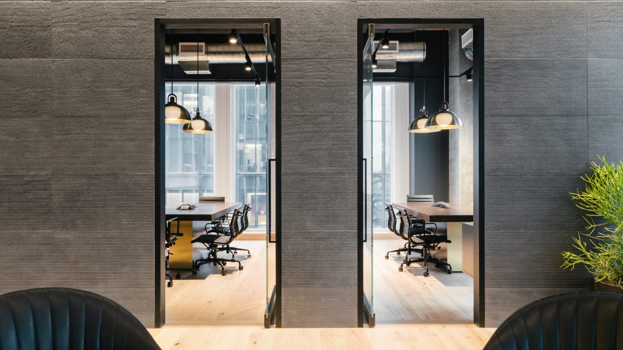 The textured, grey wallpaper brings the development’s industrial aesthetic inside.