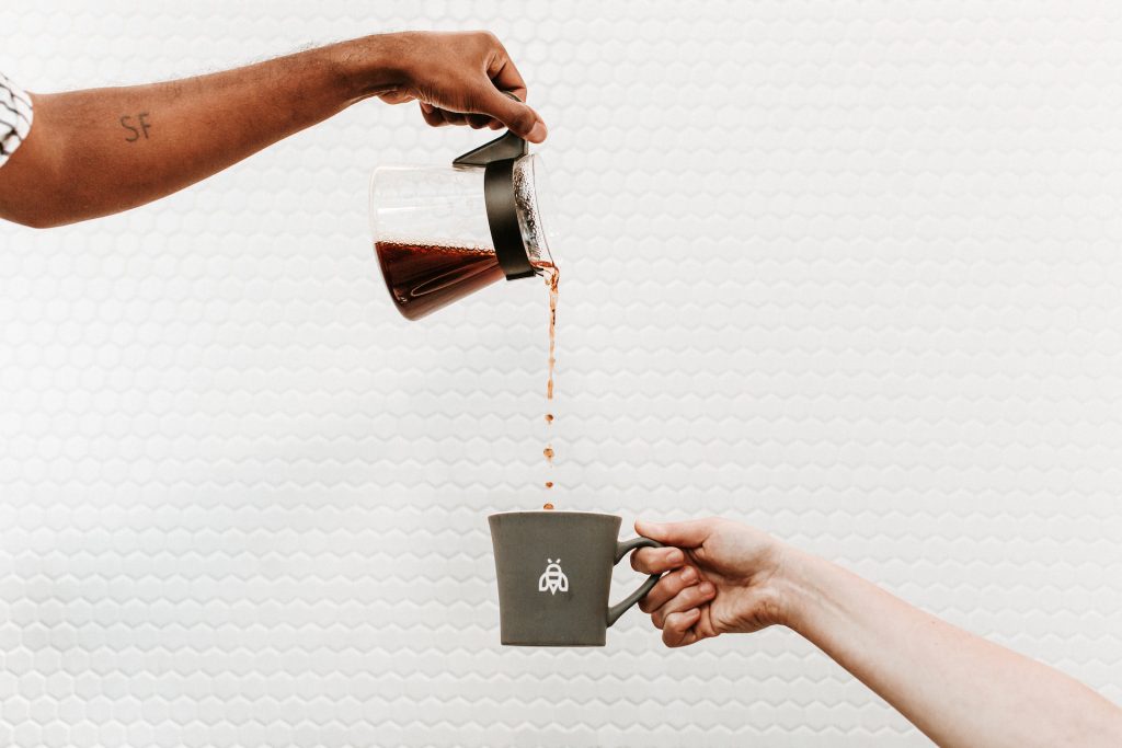 Pouring a fresh cup of coffee at Industrious Bellevue, outside Seattle. (Aspen Jeanné Photography)