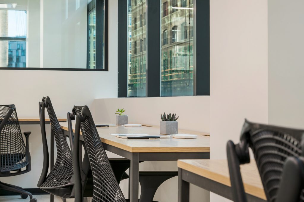 In a hybrid work model, employees split their time between the office and home.