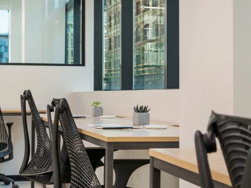 In a hybrid work model, employees split their time between the office and home.