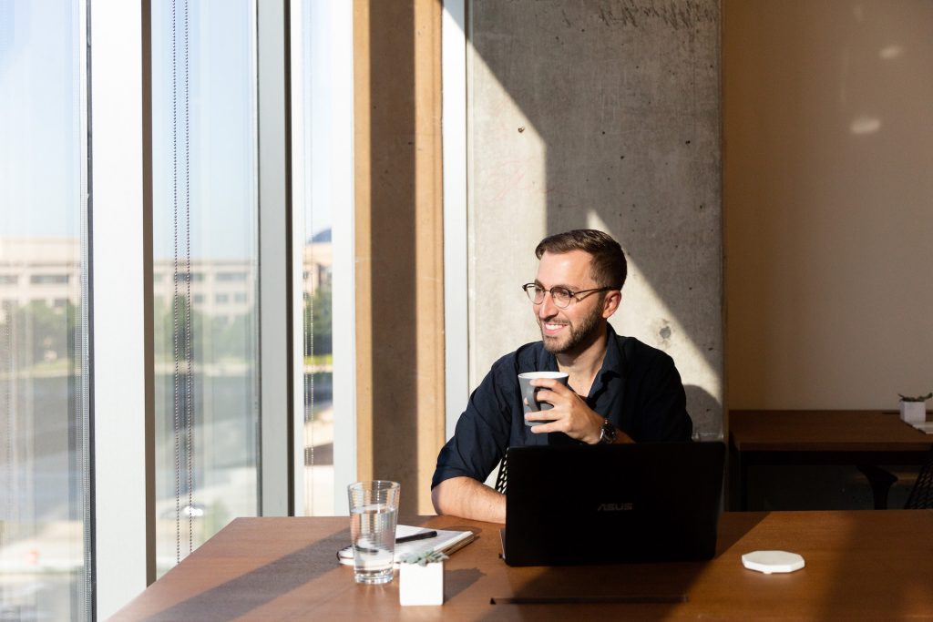 Industrious Design Manager Stephen Tortorella working out of Industrious Plano in Texas.