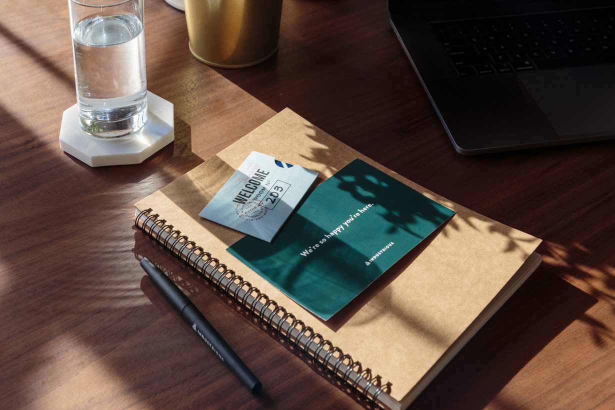 Industrious staples, like abundant office supplies and Herman Miller chairs, help transform these hotel rooms into high-end workspaces.