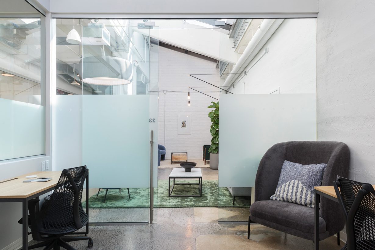 Large windows fill the private offices and suites at Industrious 1000 Dean with plenty of natural light.