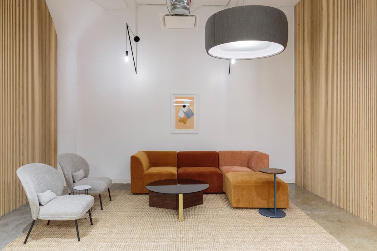 Stylish light fixtures, local artwork, and earthy color palettes add warmth to the space.