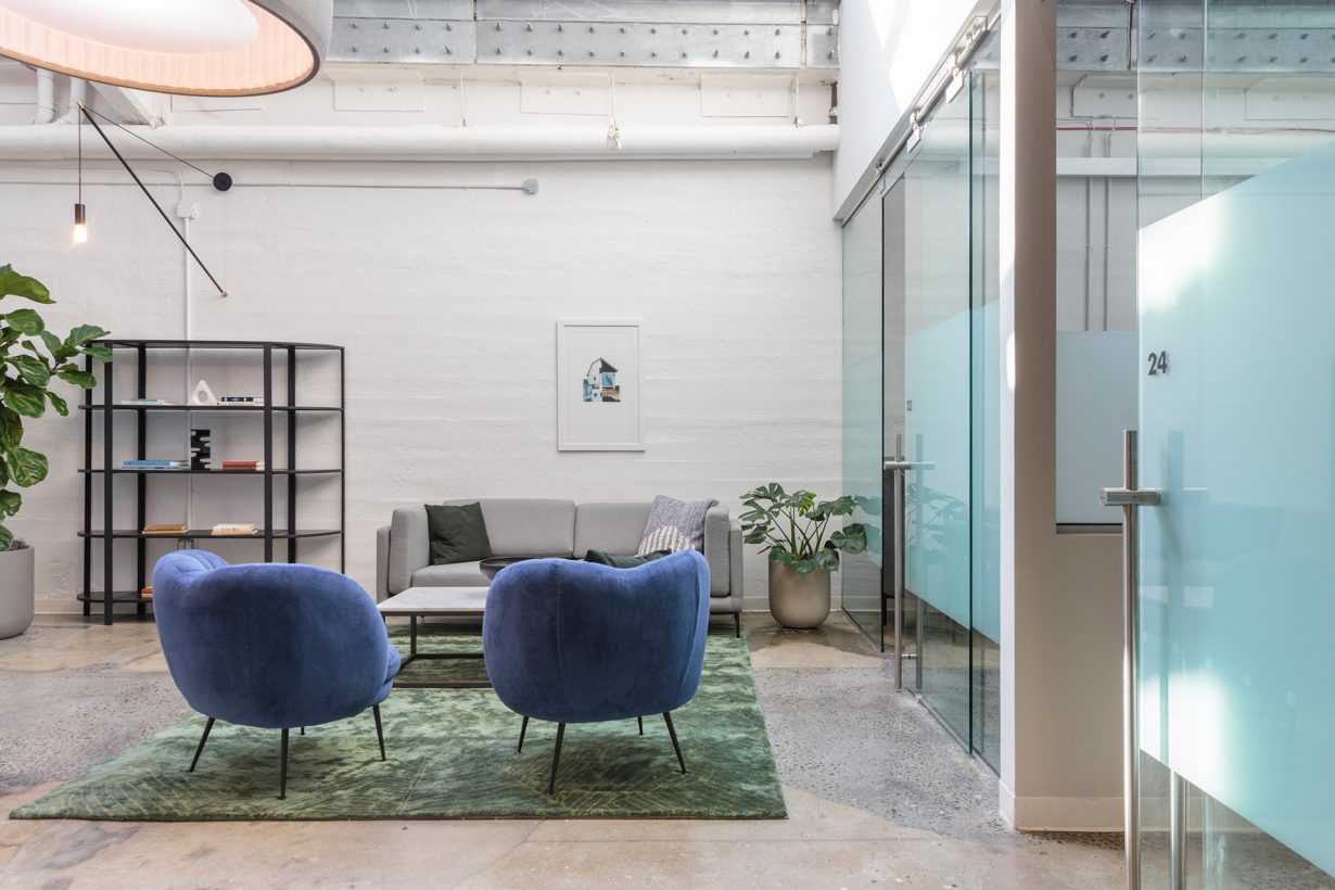 Textured walls and exposed ceilings create an industrial aesthetic throughout the location.