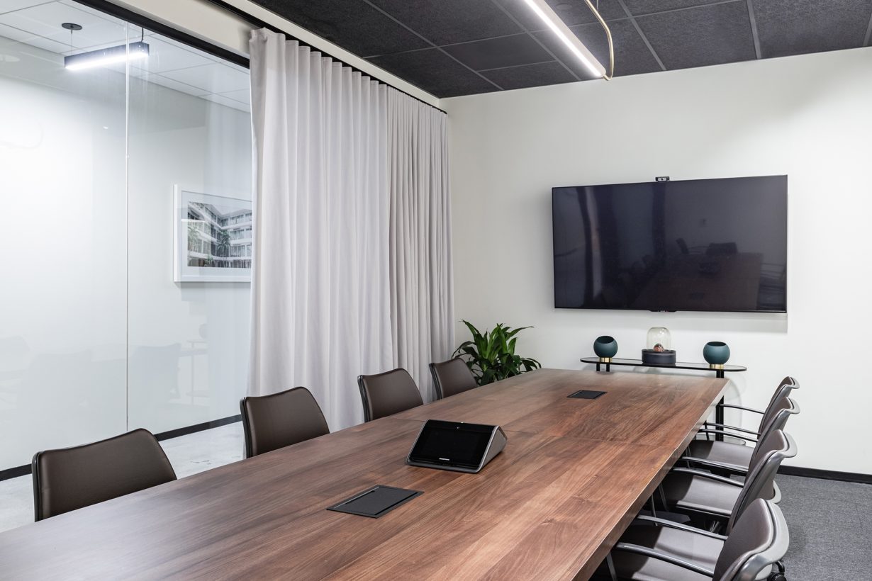 Conference rooms are equipped with A/V for presentations or hybrid meetings.